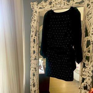 Black cocktail dress with gold beads.